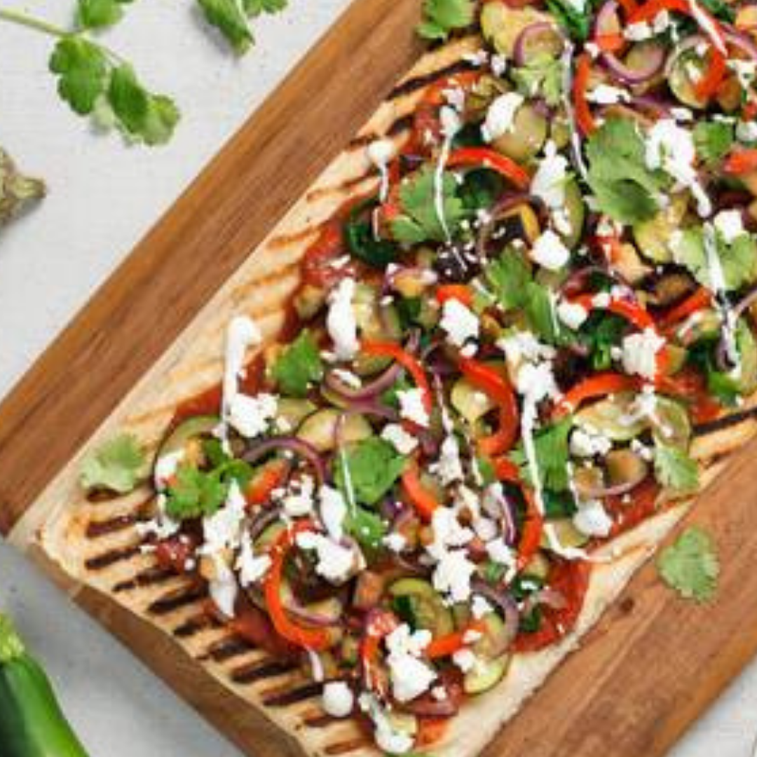 Grilled Flatbread using tandoori masala with veggies on top