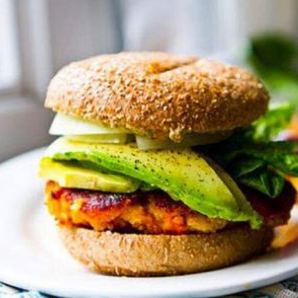 Veggie burger with chickpeas, avocado and lettuce.
