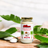 A bottle Kissan Coconut Oil 250ml with a spoon of coconut oil