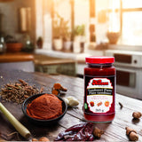 Bottle of Kissan Tandoori Paste 265g with spices around and a bowl with the paste on it.